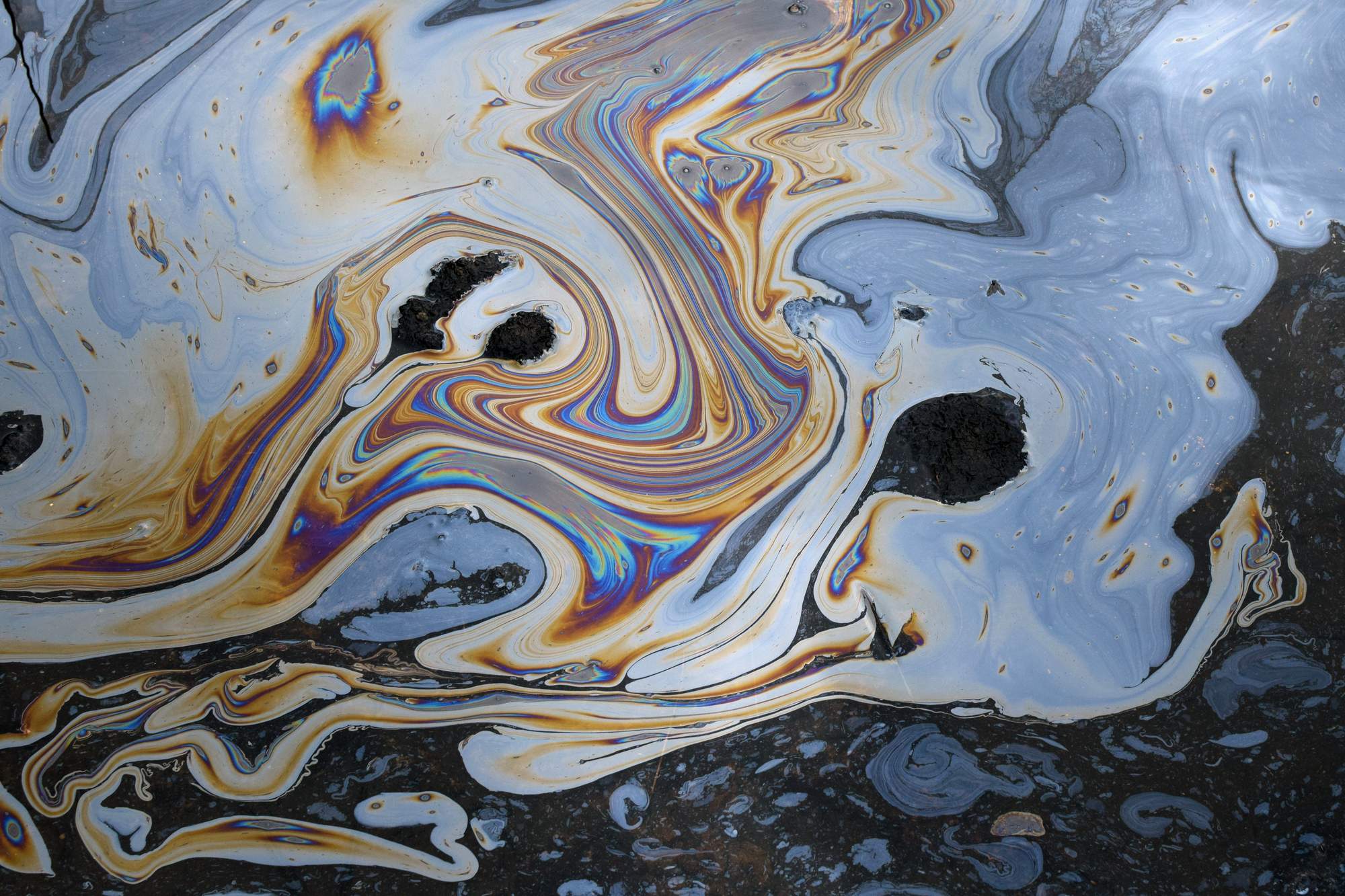 photograph of oil mixing with water