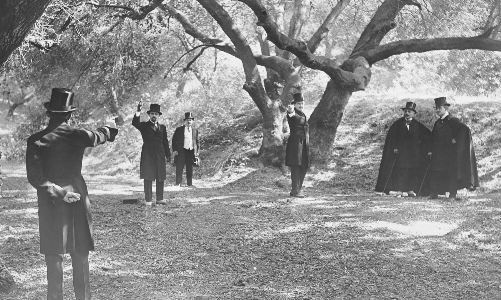 black-and-white photograph of gentlemen engaged in gun duel