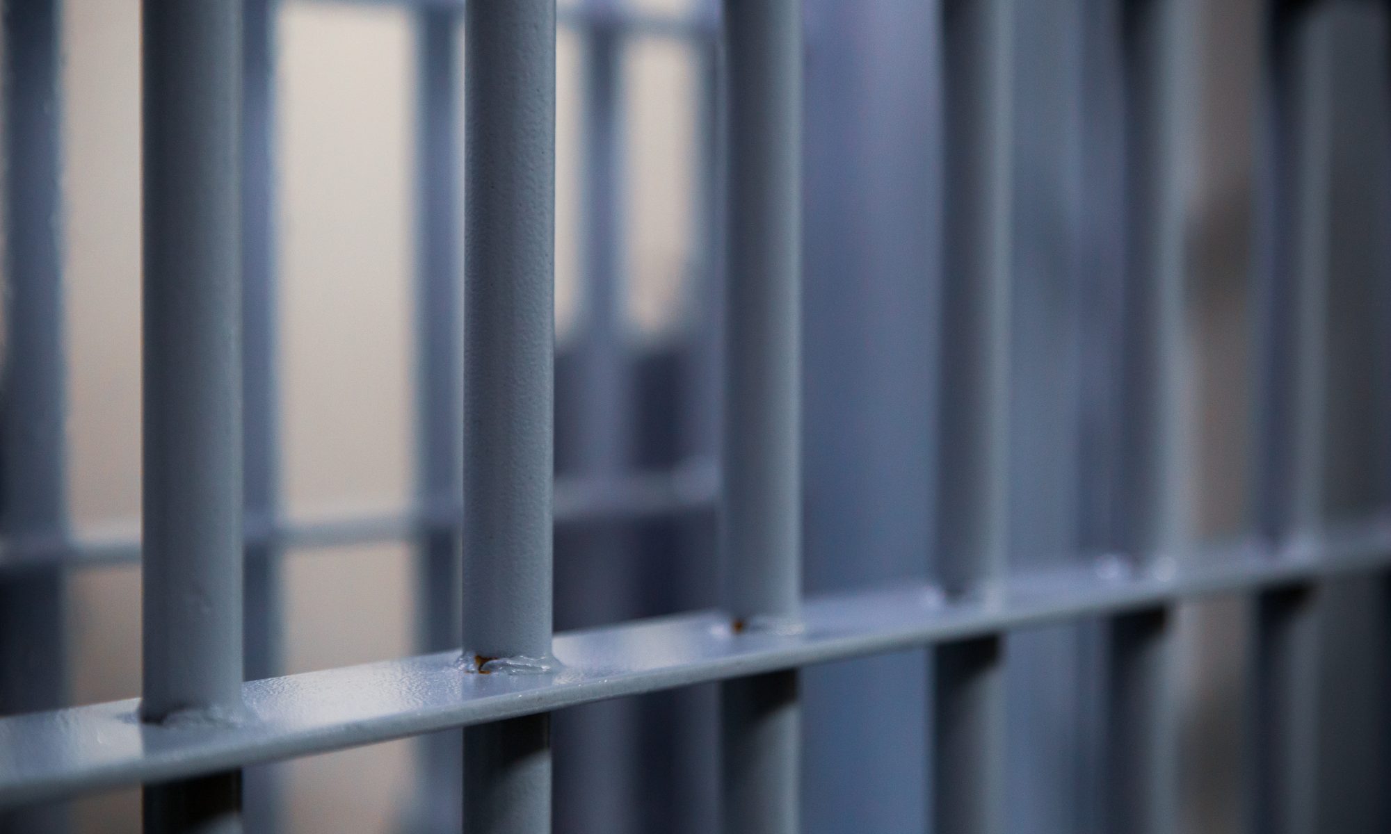 close up photograph of jail cell bars