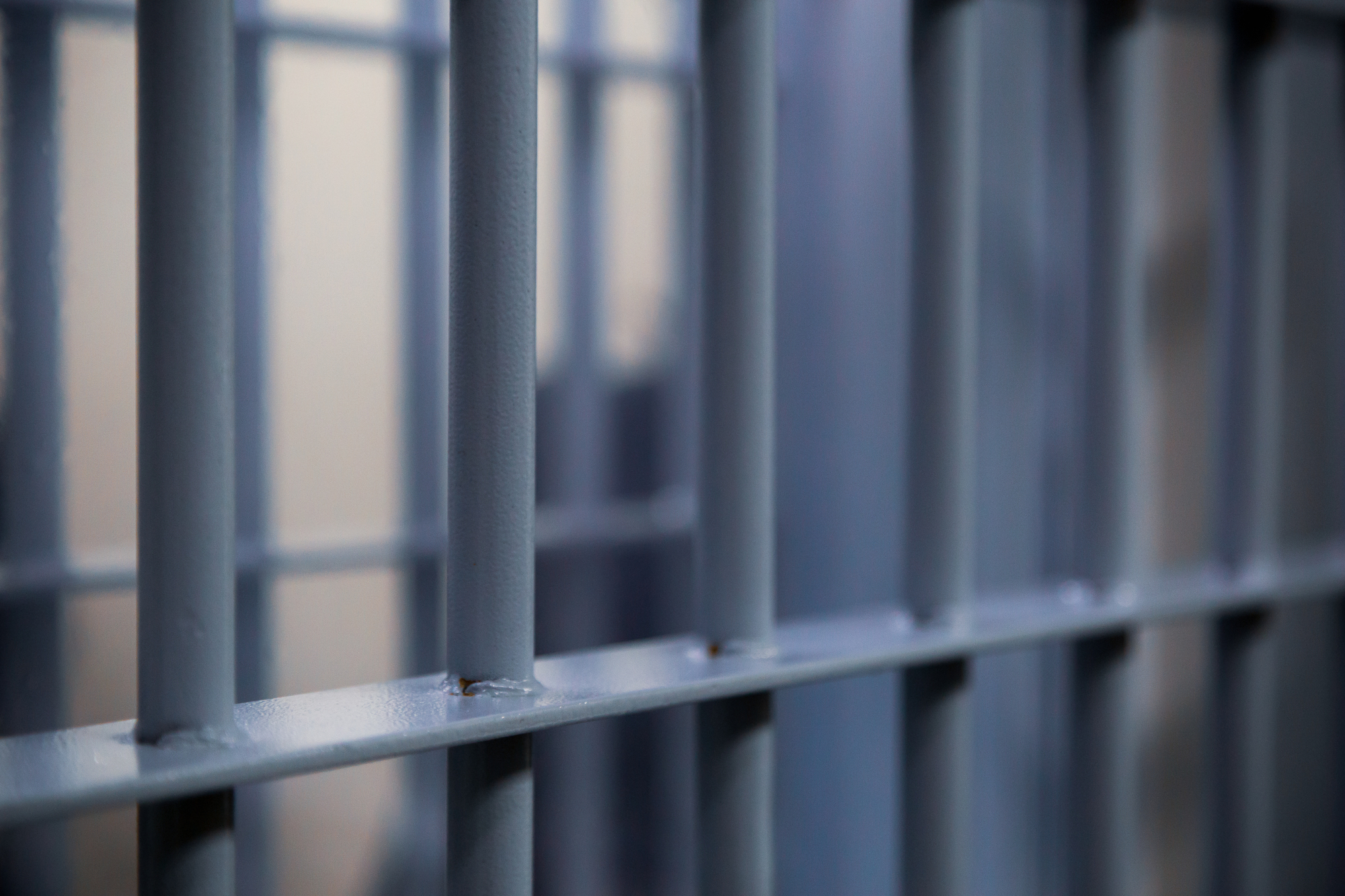 close up photograph of jail cell bars