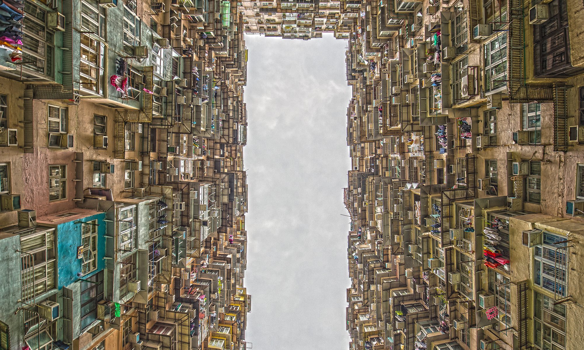 photograph from courtyard of crowded apartment building