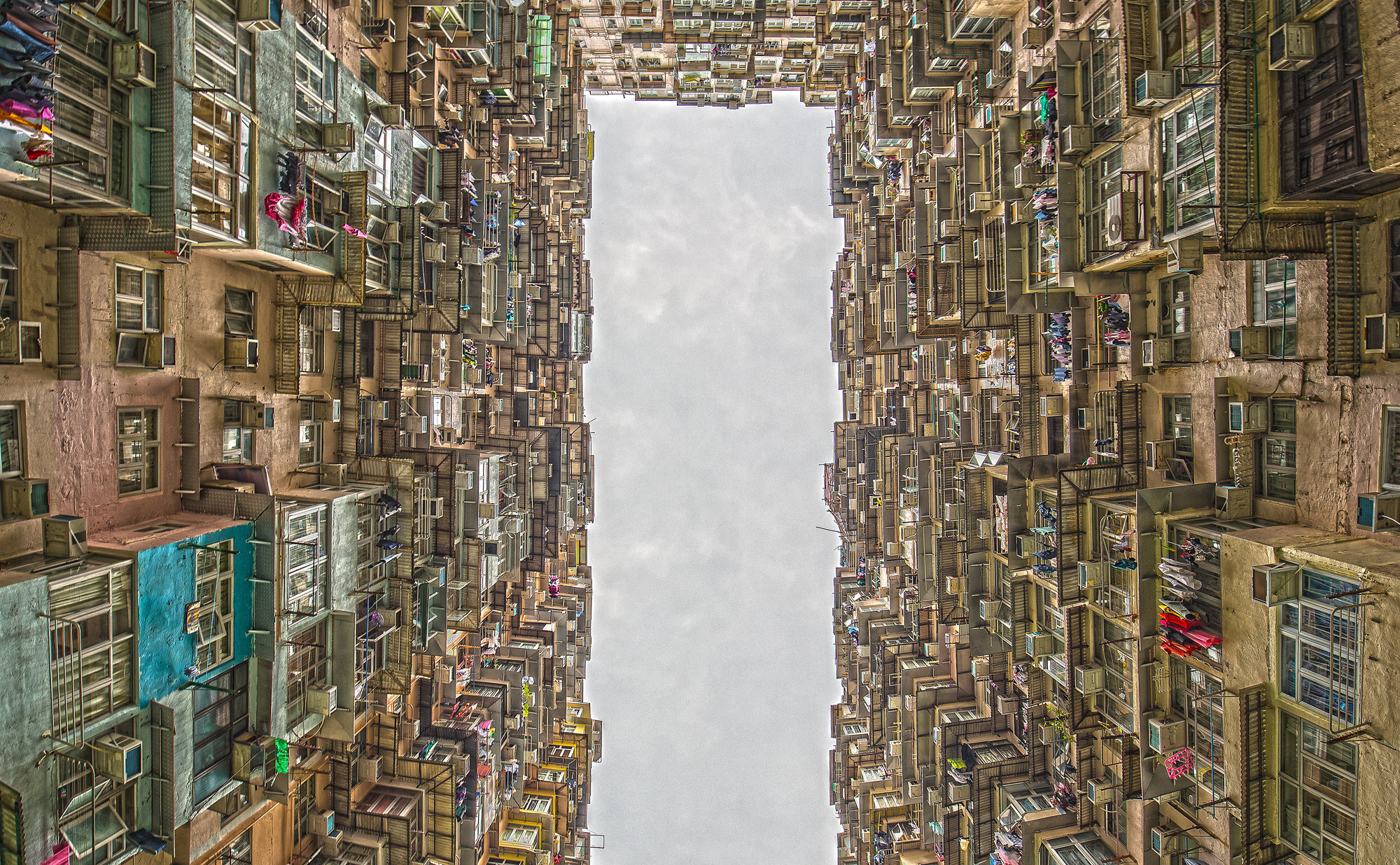 photograph from courtyard of crowded apartment building