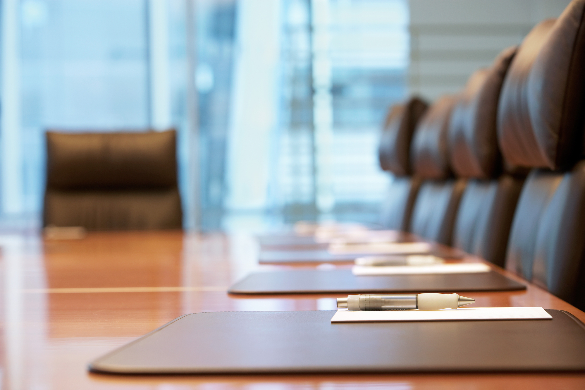 photograph of chairs in a boardroom