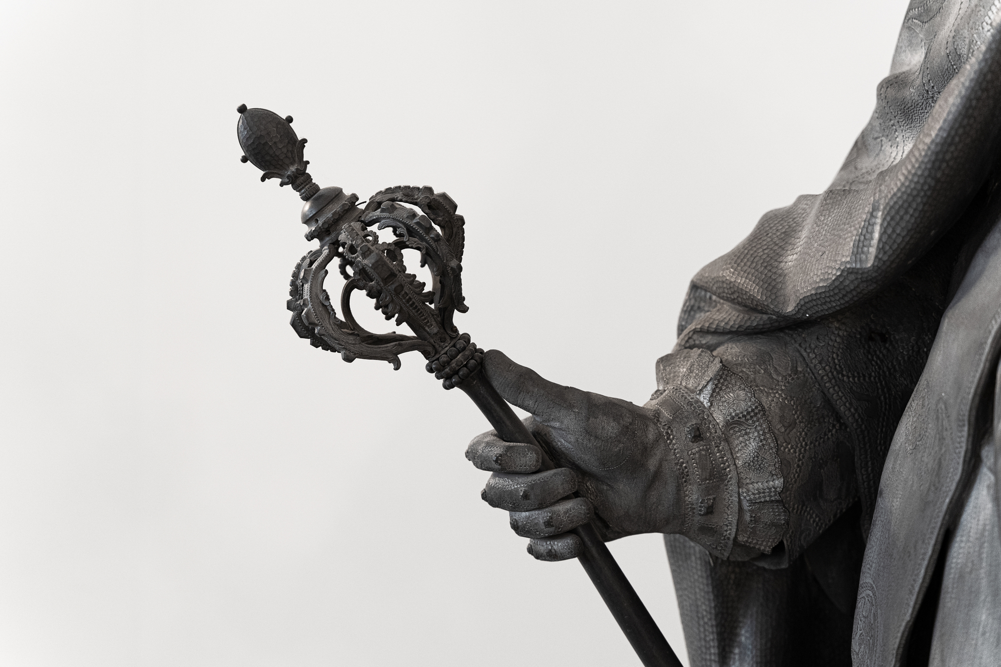 photograph of statue holding scepter