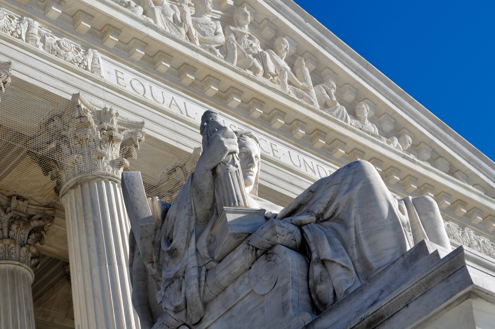 photograph of statue in front of Supreme Court building