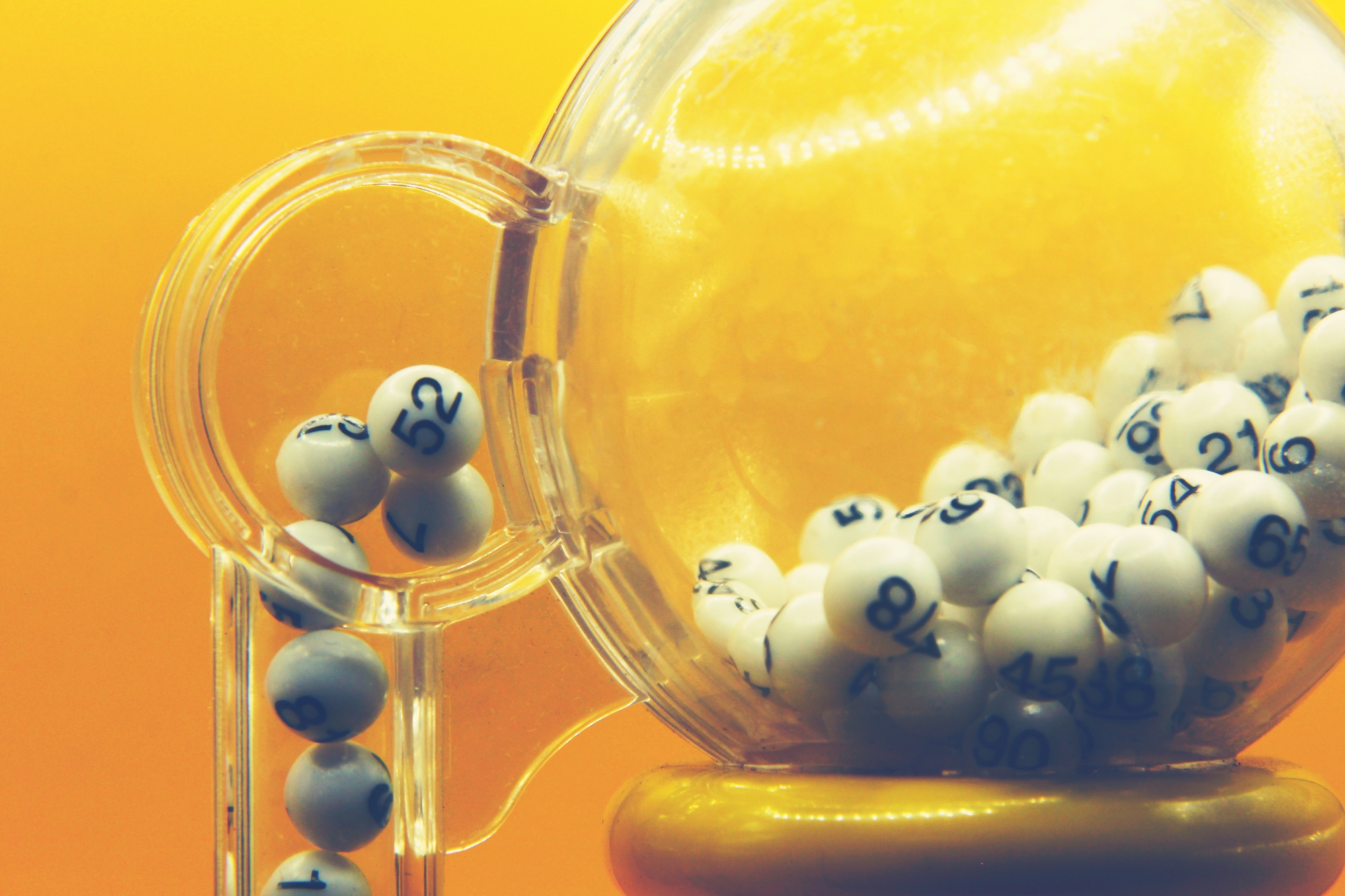 photograph of bingo balls in a lottery machine