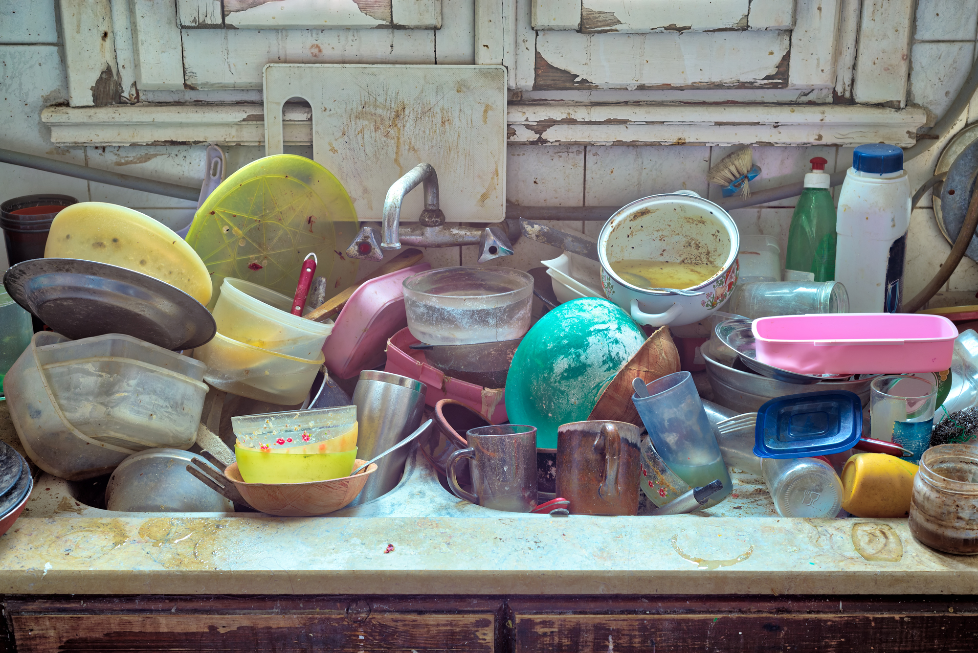 photograph of dirty dishes in sink